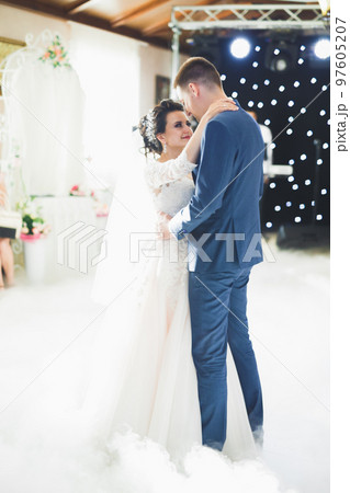 Beautiful wedding couple just married and dancing their first dance 97605207