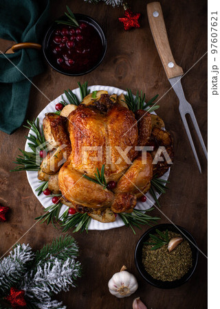 Christmas baked chicken for festive dinner. Christmas baked chicken for festive dinner. 97607621