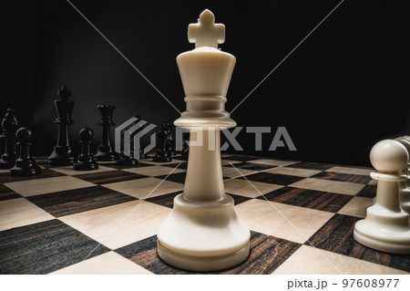 Chess figures on chess board macro photo 97608977