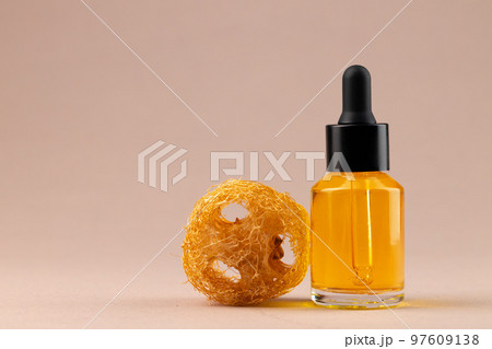 Beauty oil bottle with pipette on beige background 97609138
