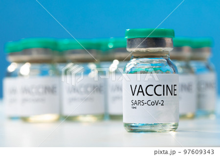 Sars-cov-2 vaccine vial bottles on white table Sars-cov-2 vaccine vial bottles on white table 97609343