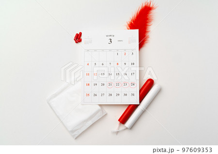 Female menstruation calendar and hygienic pads top view 97609353