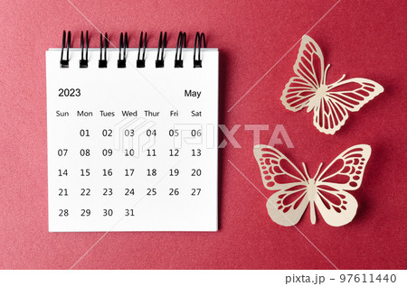 The May 2023 desk calendar for the organizer to plan and reminder with paer butterfly on red background. The May 2023 desk calendar for the organizer to plan and reminder with paer butterfly on red background. 97611440