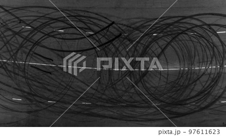 Top view tire tracks texture and background, Asphalt texture with line and tire marks, Automobile automotive tire skid mark on race track, Abstract texture car drift tire skid mark. 97611623