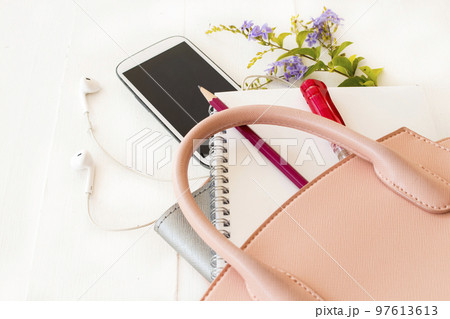 notebook planner, mobile phone in pink bag for business work  97613613