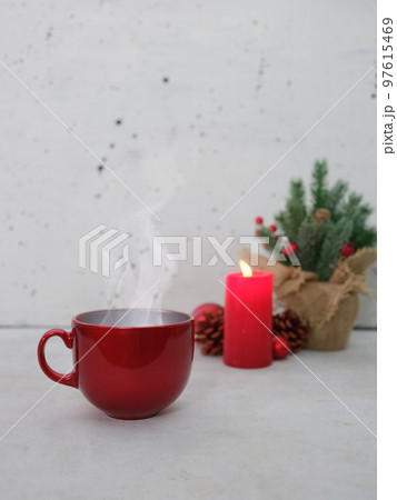 tea with a candle with Christmas decoration on a concrete background tea with a candle with Christmas decoration on a concrete background 97615469