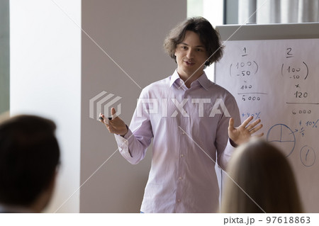 Company ceo gives flipchart presentation with sales data Company ceo gives flipchart presentation with sales data 97618863