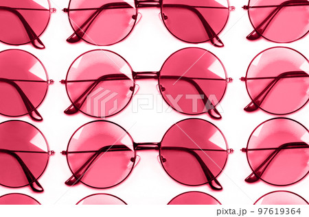 Color of year 2023.Viva magenta. Pink style glasses isolated on white background 97619364
