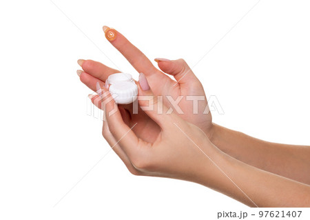 Contact eye lens. Close-up of woman hands holding white eyelense container. Contact eye lens. Close-up of woman hands holding white eyelense container. 97621407