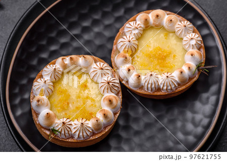 Delicious fruity sweet tart with lemon flavor and cream Delicious fruity sweet tart with lemon flavor and cream 97621755