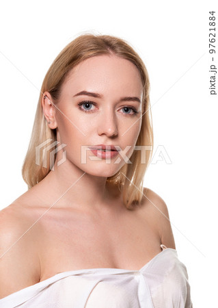 Beautiful face of young blond woman with clean fresh skin and natural make up on white background. 97621884