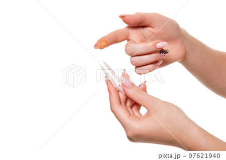 Contact eye lens. Close-up of woman holding white eye lense on finger. Contact eye lens. Close-up of woman holding white eye lense on finger. 97621940