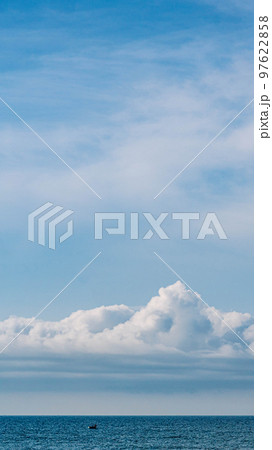 BANNER, VERTICAL STORY Atmosphere panorama white cloud clear blue sky horizon line calm empty sea. Concept paradise life. Design relax wallpaper background. More tone format in stock BANNER, VERTICAL STORY Atmosphere panorama white cloud clear blue sky horizon line calm empty sea. Concept paradise life. Design relax wallpaper background. More tone format in stock 97622858