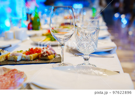 empty wine glasses on the table. tableware for the banquet.  97622896