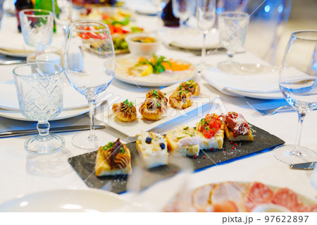 snacks and empty wine glasses on the table. catering  97622897