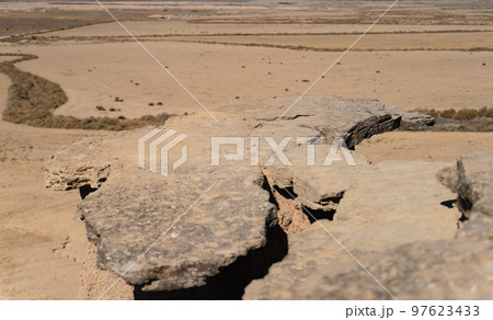 Plain rock viewpoint to the desert, focus on rock Plain rock viewpoint to the desert, focus on rock 97623433
