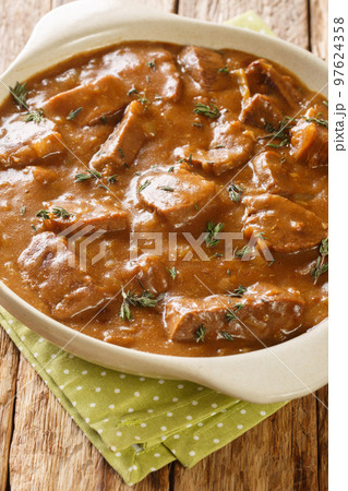Carbonnade a la Flamande Flemish Beef Stew closeup on the pot. Vertical 97624358