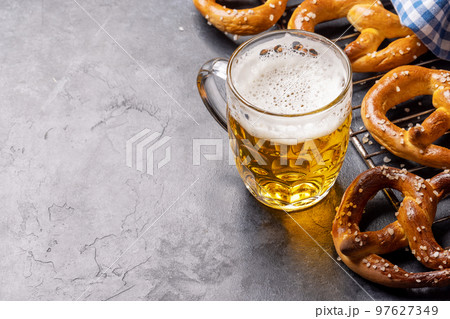 Freshly baked homemade pretzels and draft beer 97627349