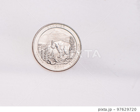 US Dollar coins President series $1 golden colored. The United States Mint honors our nation's presidents. Overhead flat lay 97629720