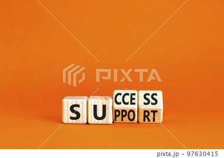 Success and support symbol. Concept word Success and Support on wooden cubes. Beautiful orange table orange background. Business success and support concept. Copy space. 97630415