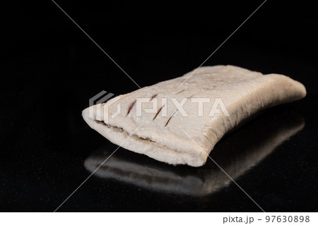 Uncooked bun with strawberry jam in electric oven: close up, black background 97630898