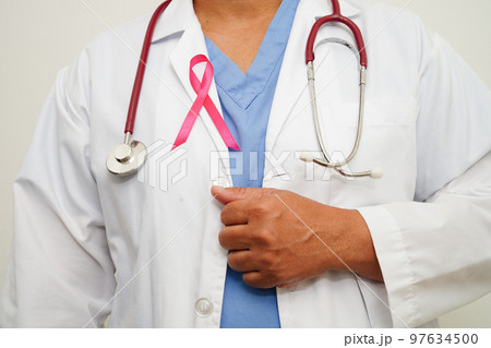 Asian woman doctor with pink ribbon, World Breast Cancer Day at October. 97634500