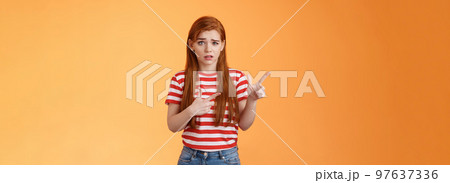 Insecure questioned frustrated cute redhead girl feel nervous unsure about suspicious offer frowning, grimacing doubtful and hesitant, pointing left look camera puzzled, asking question Insecure questioned frustrated cute redhead girl feel nervous unsure about suspicious offer frowning, grimacing doubtful and hesitant, pointing left look camera puzzled, asking question 97637336