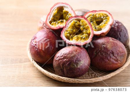 Passion fruit in basket on wooden background, Tropical fruit in summer season 97638073