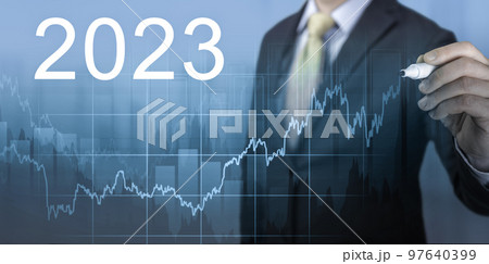global economic growth in 2023. growth of economic indicators in 2023. fast growth chart for 2023. Data analysis. businessman draws a graph of the growth of economic activity 97640399