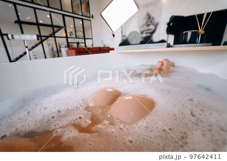 Female buttocks closeup in bath Female buttocks closeup in bath 97642411