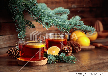 Tea with lemon on a wooden table. 97643738