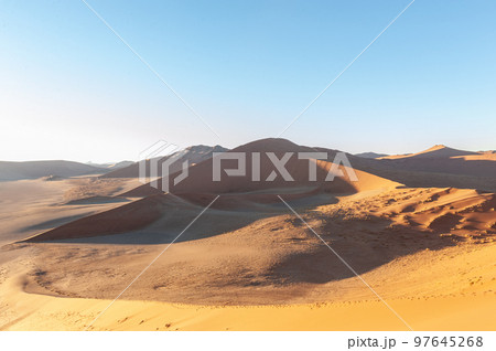 Climbing Dune 45 at sunrise 97645268