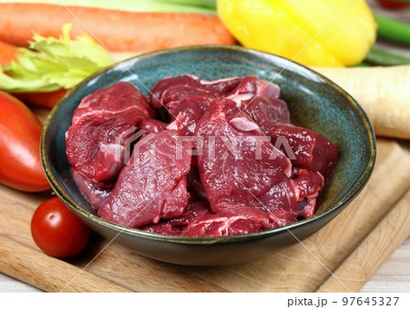 Raw deer meat for venison ragout or goulash 97645327