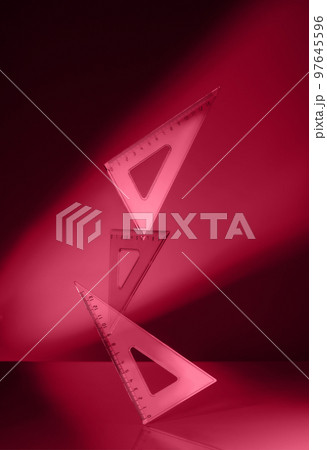 Creative minimal composition made with school supplies flying in the air on isolated black background with copy space. Toned image in trendy magenta color of year 2023. Back to school. 97645596
