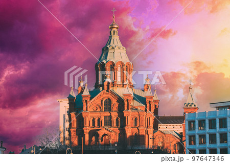 Helsinki, Finland. Uspenski Cathedral At Morning. Red Church Is Popular Tourist Destination In Finnish Capital. Sunrise Sky Natural Background. Amazing Color Effect Of Clouds. Soft Colors Helsinki, Finland. Uspenski Cathedral At Morning. Red Church Is Popular Tourist Destination In Finnish Capital. Sunrise Sky Natural Background. Amazing Color Effect Of Clouds. Soft Colors 97647346