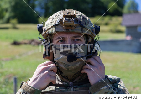 Special operations soldiers team preparing tactical and communication gear for action battle. Long distance sniper team in checking gear for action Special operations soldiers team preparing tactical and communication gear for action battle. Long distance sniper team in checking gear for action 97649483