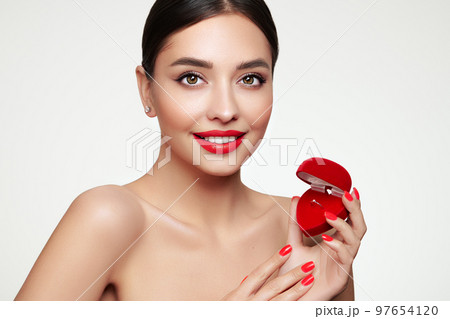 Young beautiful woman with wedding ring gift Young beautiful woman with wedding ring gift 97654120