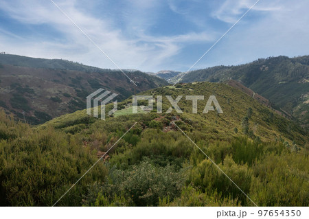 Beautiful view of the mountains on the island. Green mountain valley. Beautiful view of the mountains on the island. Green mountain valley. 97654350