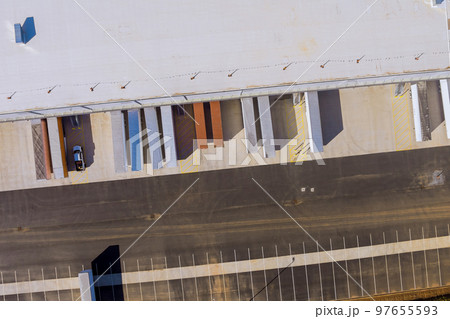 Aerial top view of industrial zone with buildings and cargo trailer near logistics center Aerial top view of industrial zone with buildings and cargo trailer near logistics center 97655593