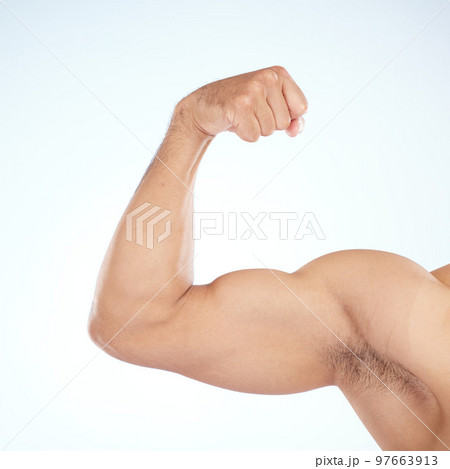 Bodybuilder, bicep muscle and closeup in studio for gym, wellness or fitness by blue background. Model, growth or development for flex, strong or healthy from exercise, workout or training of body Bodybuilder, bicep muscle and closeup in studio for gym, wellness or fitness by blue background. Model, growth or development for flex, strong or healthy from exercise, workout or training of body 97663913