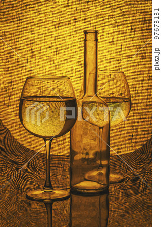 Still life with a bottle and glasses on a mesh background Still life with a bottle and glasses on a mesh background 97673131