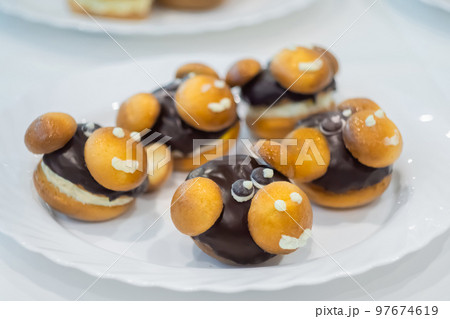 Fresh shortcrust tart cakes with chocolate and sweet mushrooms for sale Fresh shortcrust tart cakes with chocolate and sweet mushrooms for sale 97674619