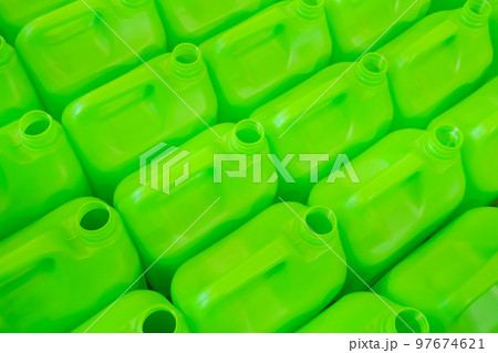 Close up: many empty green plastic jerrycans background 97674621