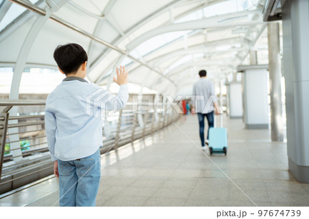 Man embracing his son. 97674739