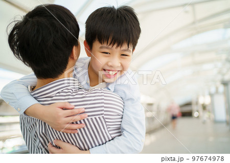 Man embracing his son. Man embracing his son. 97674978