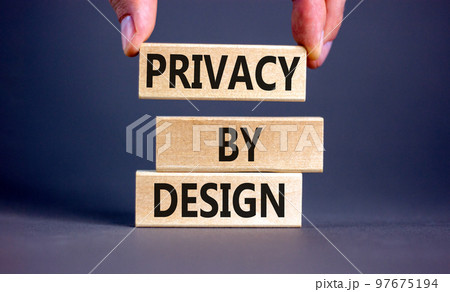 Privacy by design symbol. Concept words Privacy by design on wooden blocks on a beautiful grey table grey background. Businessman hand. Business, finacial and privacy by design concept. Copy space. Privacy by design symbol. Concept words Privacy by design on wooden blocks on a beautiful grey table grey background. Businessman hand. Business, finacial and privacy by design concept. Copy space. 97675194