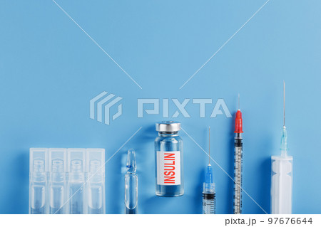 Medicine in ampoules with insulin, needles and syringes for medical subcutaneous injection 97676644