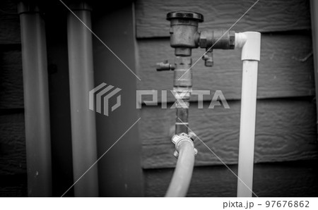 Winterizing a residential irrigation system by using a compressor and forced air to blow the lines empty. 97676862