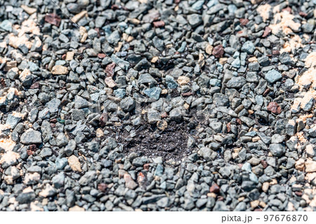 Macro of hail damage on a shingle residential roof circled with a chalk outline during a home inspection. Macro of hail damage on a shingle residential roof circled with a chalk outline during a home inspection. 97676870