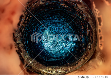 Front view looking inside a flexible pipe with thermal fiberglass insulation wrapping 97677010